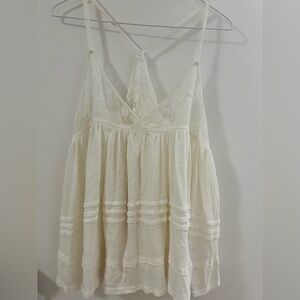 Free people top new without tag. Never worn. Delicate and feminine.